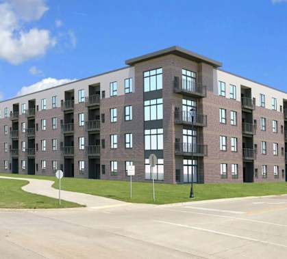 A large apartment complex with multiple buildings and balconies.