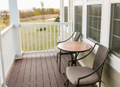 Thumbnail 15 of 23 - balcony at VistaView apartments in Frederick, MD  with table and two chairs at VistaView, Maryland, 21702