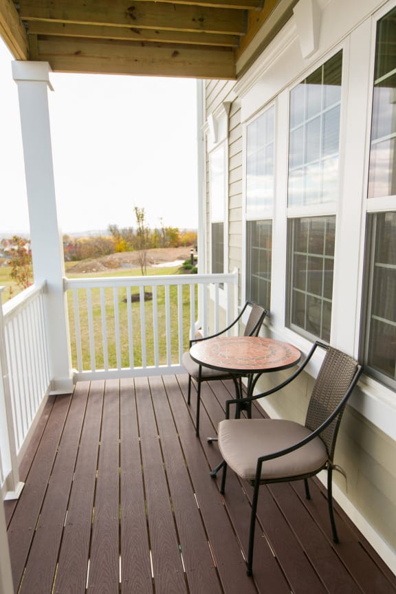 balcony at VistaView apartments in Frederick, MD  with table and two chairs at VistaView, Maryland, 21702