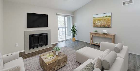 a living room with a fireplace and a sliding glass door