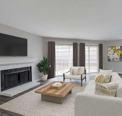 A living room with a fireplace and a couch.
