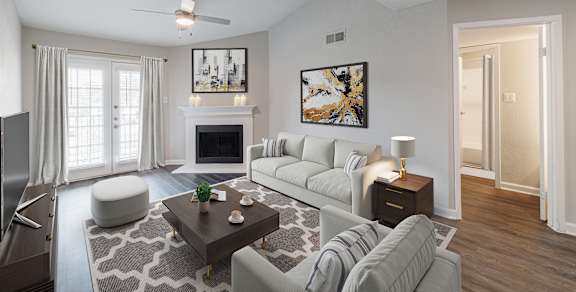 a living room with a fireplace and a sliding glass door