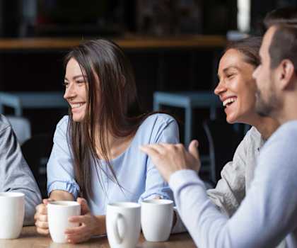 a group of people sitting at a table drinking coffee at Promenade at Reflection Lakes, Florida