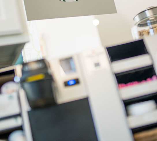 A Starbucks sign hangs above a counter.