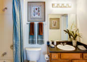 Thumbnail 3 of 13 - Bathroom with a shower, sink, and toilet