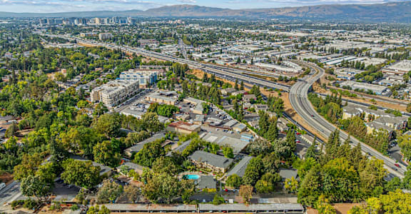 A cityscape with a highway running through it.