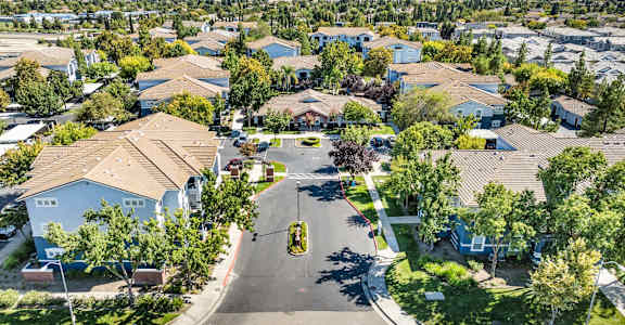 A residential area with houses and trees.