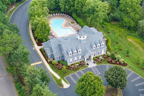 A large house with a pool in the backyard.