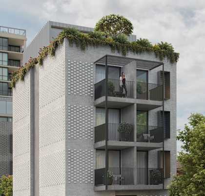 a tall building with balconies and a tree on top of it