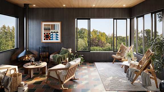 A modern living room with wooden furniture and a large window overlooking a forest.