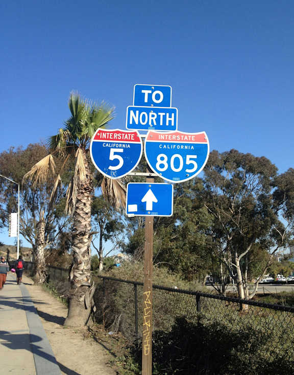 A signpost with two signs on it, one for Interstate 5 North and one for Interstate 805 North.