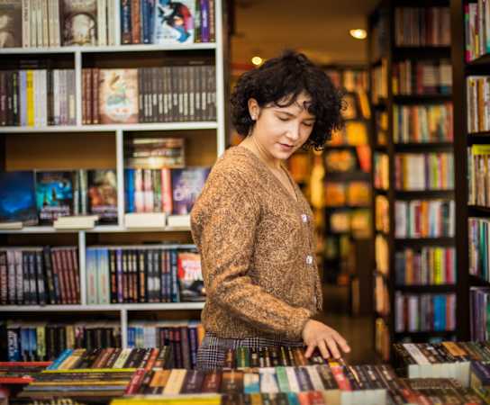 a woman looking at books in a bookstore at Thornberry Apartments, Charlotte North Carolina