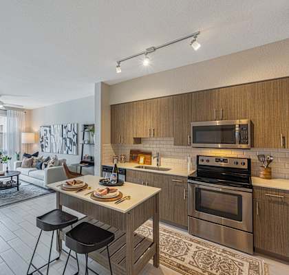 a kitchen and living room in an apartment