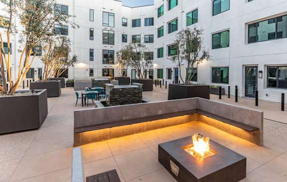 Rooftop seating with fire pit at Urbana Apartments, Chula Vista, CA, 91910