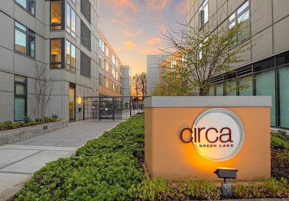 A sign that says "circa" in front of a building.