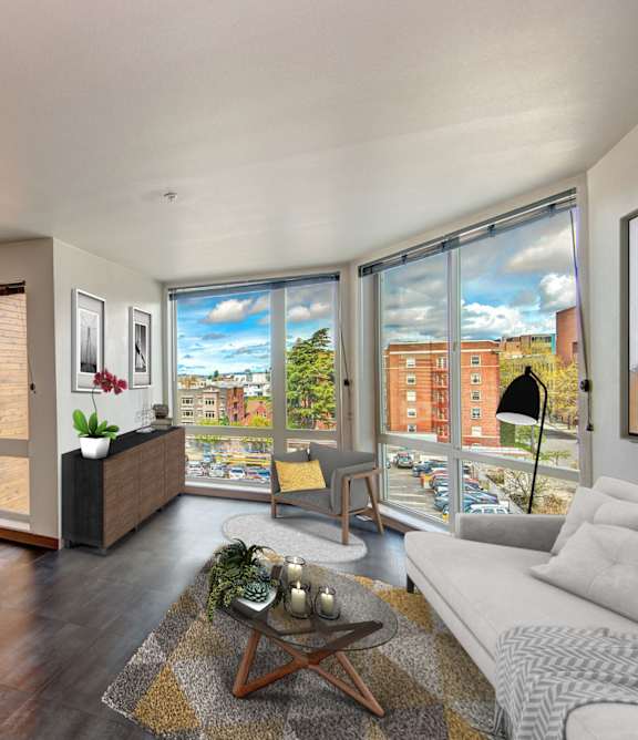Living room with desk and large windows