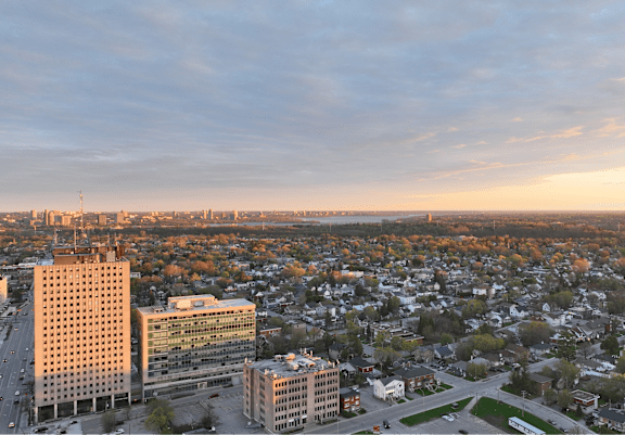 A cityscape with buildings and a road.