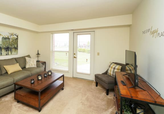 Living Room with TV at Tracy Creek Apartment Homes in Perrysburg, OH