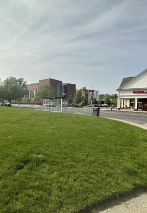 a grassy area in front of a building