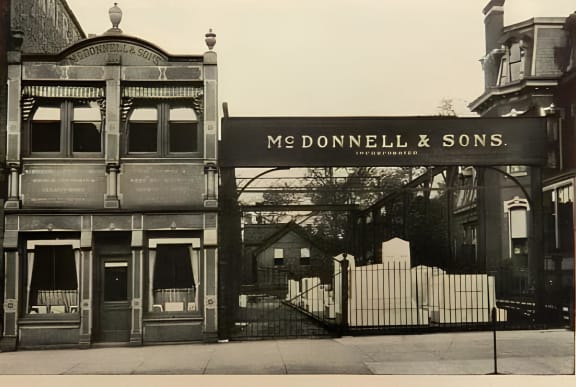 a black and white photo of a building with a sign at The Granite Works Apartments , Buffalo, NY, 14202