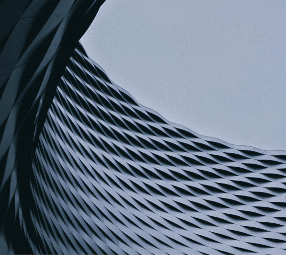 the roof of a building with a blue sky in the background