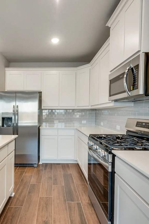 A Modern Kitchen at Cottages at Beltmill Apartments, Saginaw, TX