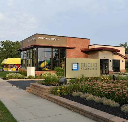 The front of a building with the name Euclid Apartments on it.