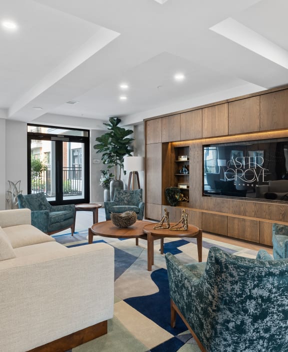a living room with couches and chairs and a television