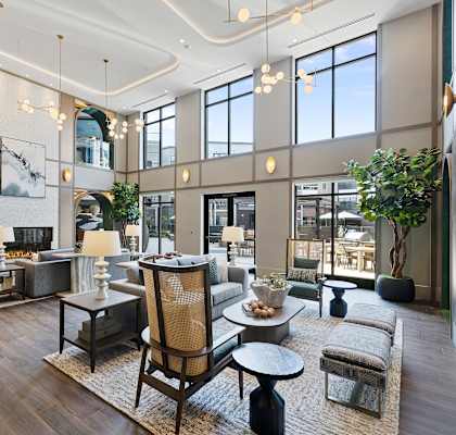 A modern living room with a large sofa set and a coffee table.