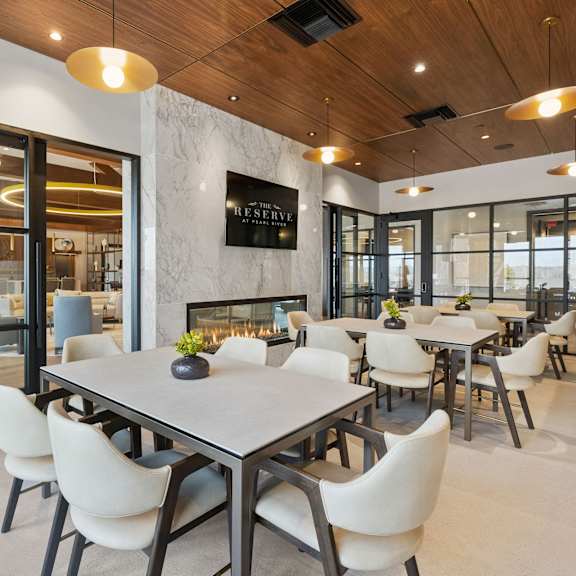 A modern dining room with a large table and chairs. at The Reserve at Pearl River Apartments, Pearl River, NY, 10965