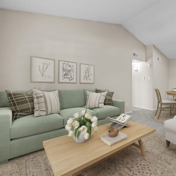 a living room filled with furniture and a large window