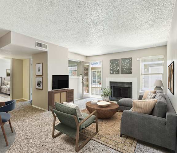 a living room with a couch and a fireplace