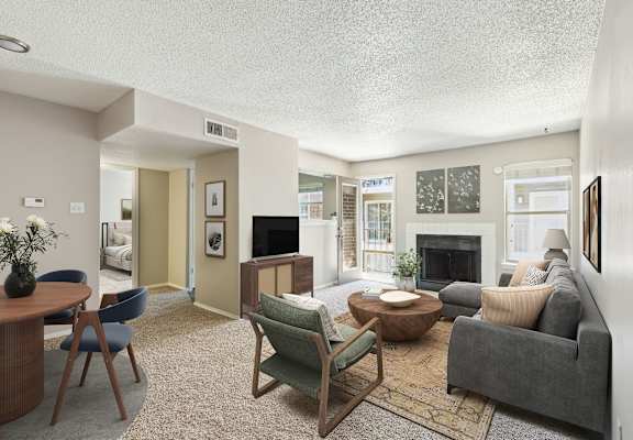 a living room with a couch and a fireplace
