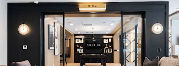a living room with couches and a table at Stonehill at West Orange, West Orange, New Jersey