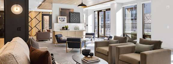 A living room with a couch, chairs, and a coffee table. at Stonehill at West Orange, West Orange, New Jersey