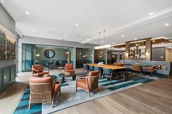 A modern living room with wooden floors and furniture.