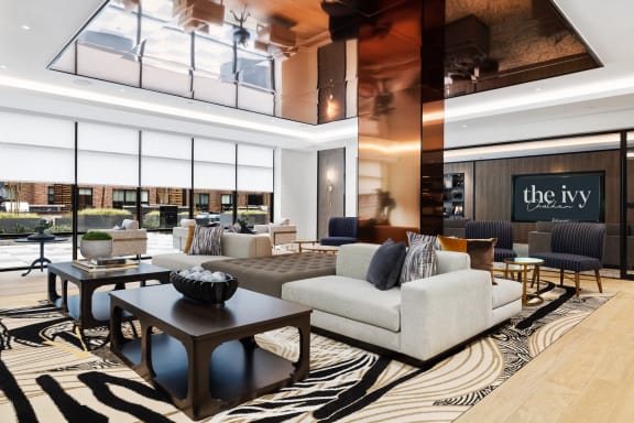 a rendering of a clubhouse with couches and chairs