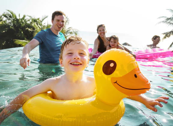 Family swimming in the pool