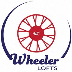 a logo for wheeler lofts is shown on a sign