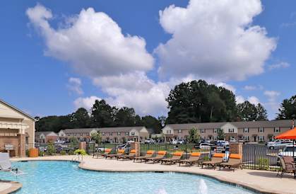 A pool surrounded by chairs and a sign that says "LIMITED TIME SPECIAL".