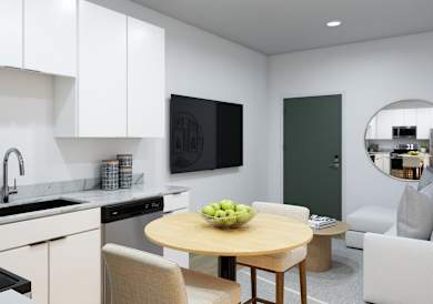 A modern kitchen with a table and chairs.