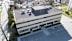 a view from above of a large office building with a gray roof