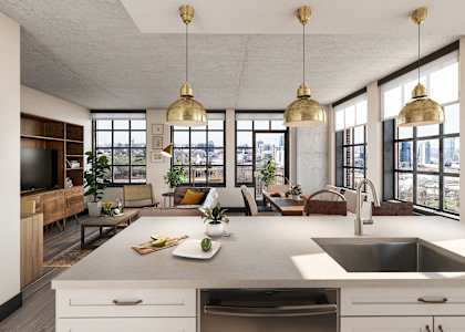 a kitchen and living room in an apartment with large windows