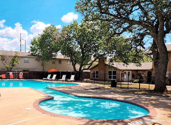 our apartments have a large swimming pool with chairs