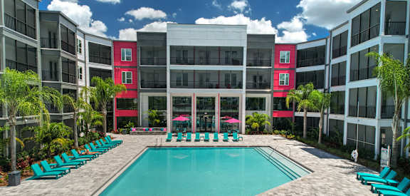 a swimming pool in front of an apartment building at Pinnacle Apartments , Florida, 32256
