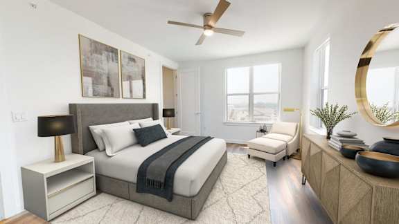 a bedroom with a large bed and a ceiling fan