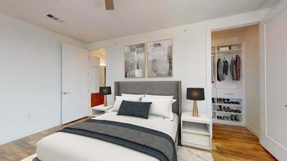 a bedroom with a bed and a closet