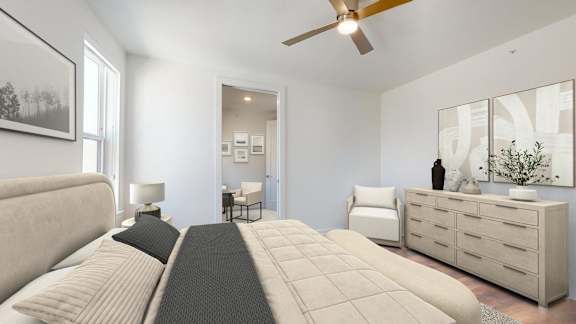 a bedroom with a large bed and a ceiling fan