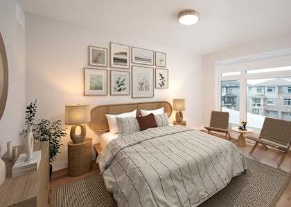 a bedroom with a large bed and a window