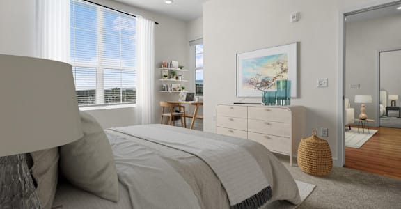 a bedroom with a bed and a dresser and a window